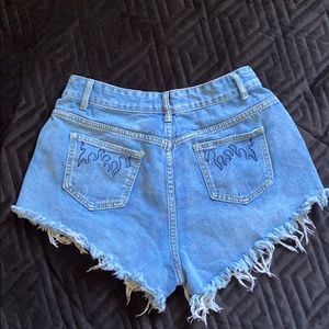 denim shorts + embroidered flames on the pockets